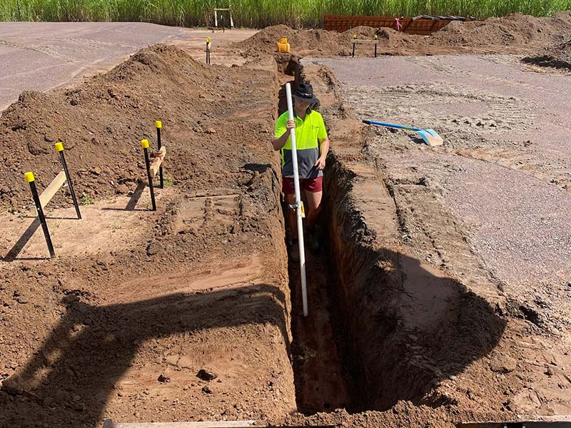 Chandley Plumbing staff members digging trench