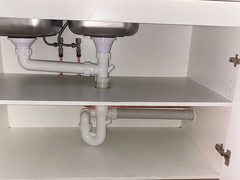 Underneath kitchen sink